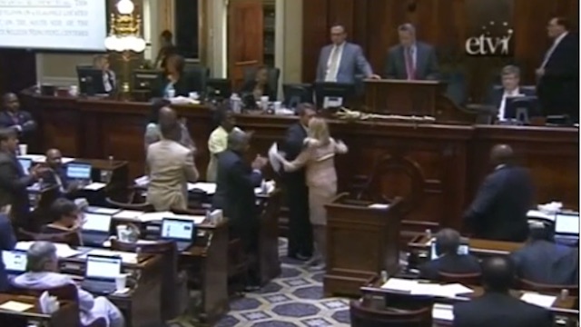 South Carolina Rep Jenny Horne hugs Representatives after asking  the House to take the Confederate flag down
